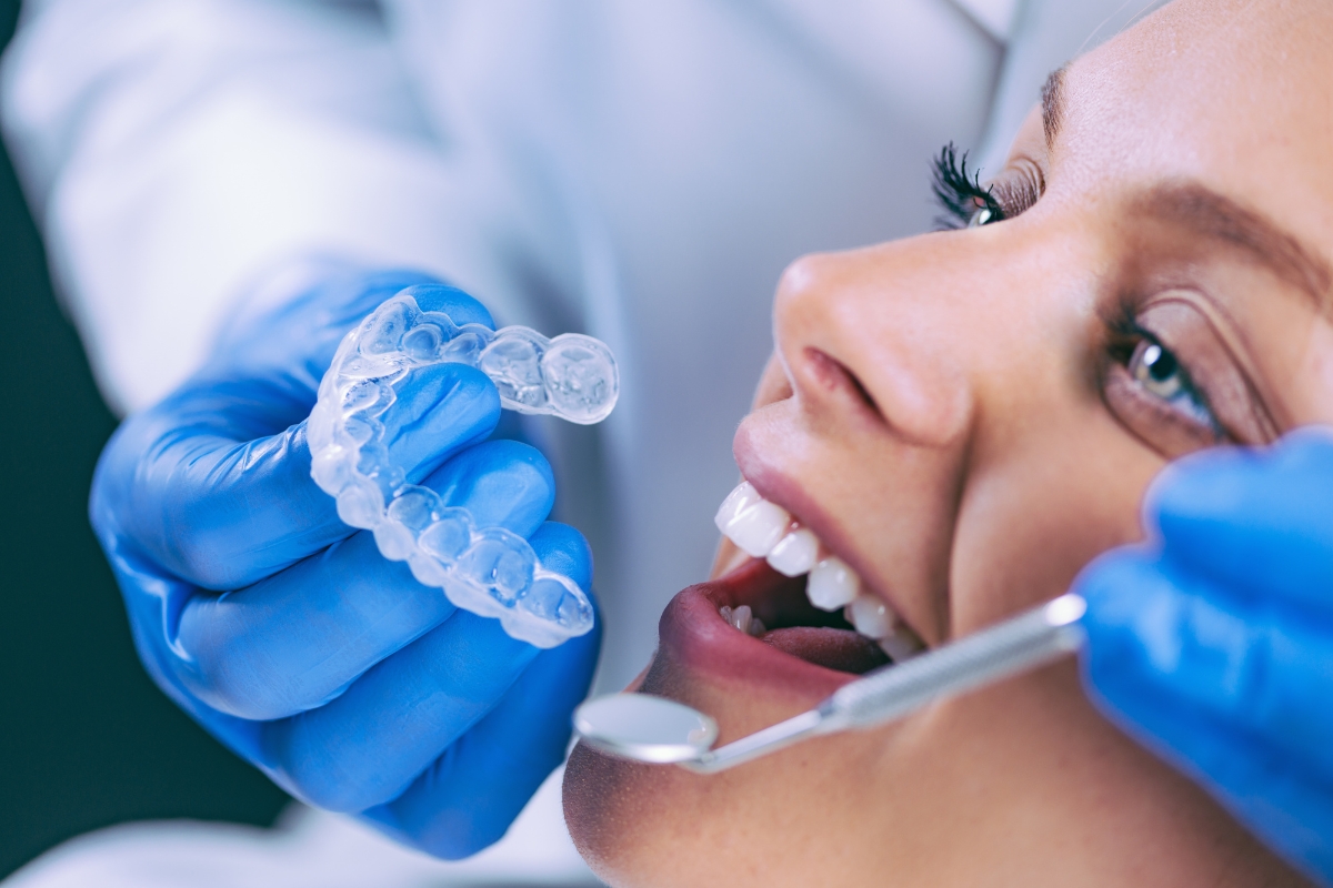 Patient learning proper Invisalign aligner care during dental visit